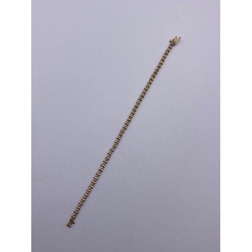 406 - 9CT GOLD CZ CHIP TENNIS BRACELET 19CM APPROX 4.3G APPROX