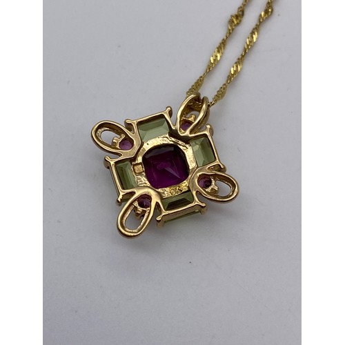 437 - 9CT GOLD ROPE TWIST CHAIN WITH AMETHYST AND PERIDOT LOZENGE PENDANT 44CM 3.2G OVERALL APPROX