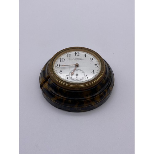 371 - CASED FAUX TORTOISE SHELL ROUNDEL TRAVELLING CLOCK THE ENAMEL DIAL SIGNED GRIEVES NEW STREET BIRMING... 