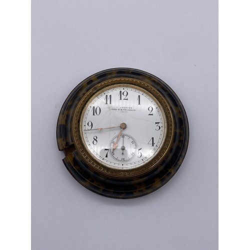 371 - CASED FAUX TORTOISE SHELL ROUNDEL TRAVELLING CLOCK THE ENAMEL DIAL SIGNED GRIEVES NEW STREET BIRMING... 