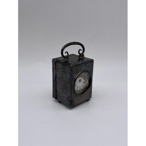 361 - BEATEN SILVER MINIATURE CASED TRAVELLING CARRIAGE CLOCK WITH FRENCH MOVEMENT A/F 9.9 OZ OVERALL APPR... 