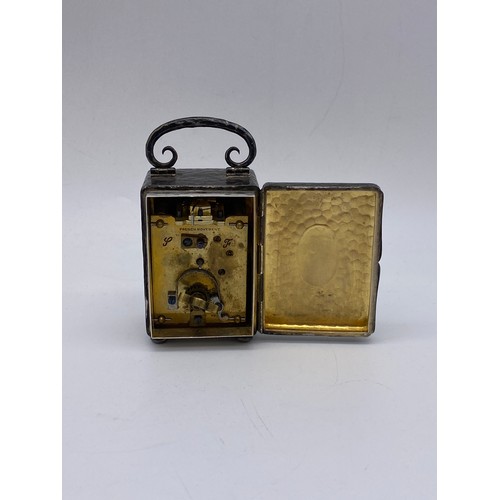 361 - BEATEN SILVER MINIATURE CASED TRAVELLING CARRIAGE CLOCK WITH FRENCH MOVEMENT A/F 9.9 OZ OVERALL APPR... 