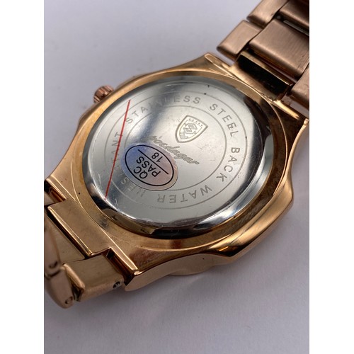 717 - GENTS ROSE TONE STAINLESS STEEL DATE ADJUST WRISTWATCH