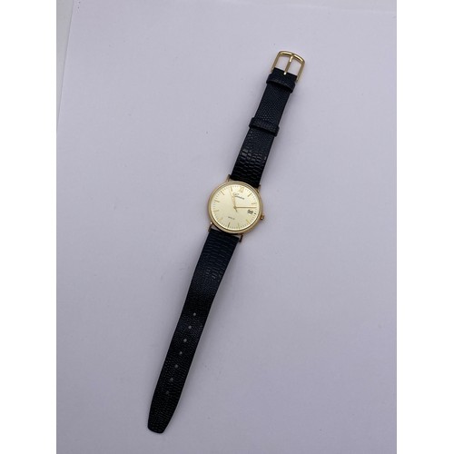 736 - BOXED GENEVE 9CT GOLD CIRCULAR WRISTWATCH ON LEATHER STRAP