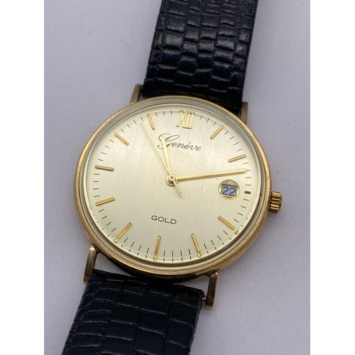 736 - BOXED GENEVE 9CT GOLD CIRCULAR WRISTWATCH ON LEATHER STRAP