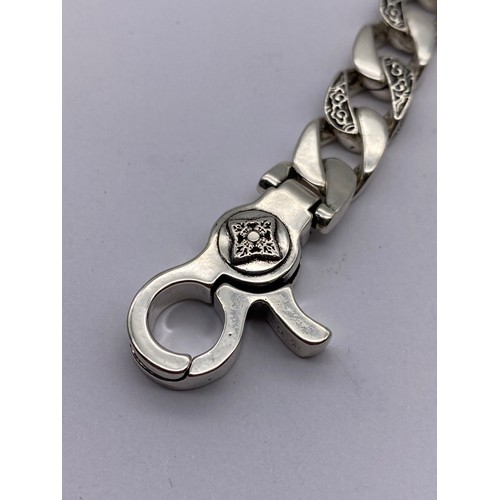 716 - GENTS STAINLESS STEEL FLAT CURB AND ENGRAVED LINK BRACELET