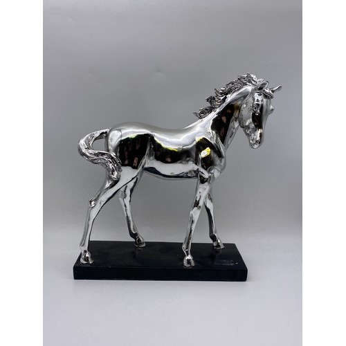 658 - SILVERED RESIN MODEL OF A HORSE