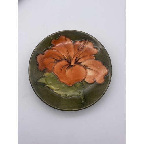 602 - MOORCROFT POTTERY HIBISCUS PATTERN BOWL, PAIR OF PIN DISHES AND SHALLOW BOWL (RIM A/F)