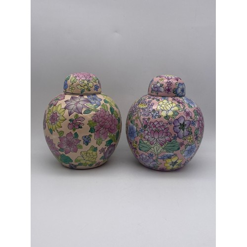 303 - PAIR OF 20TH CENTURY CHINESE GLOBULAR JARS AND COVERS DECORATED WITH BLOSSOM AND FLOWERS