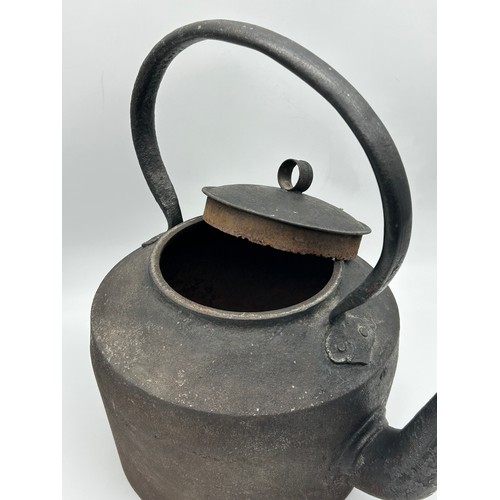 325 - OVERSIZED CAST IRON KETTLE