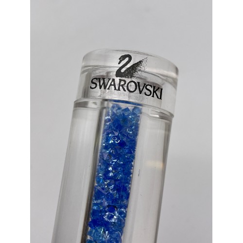 527 - PHIAL OF SWAROVSKI CRYSTAL “BRILLIANT ACCENTS” IN BLUE