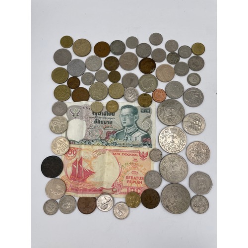 519 - MUG OF JUBILEE CROWNS AND OTHER FOREIGN CURRENCY