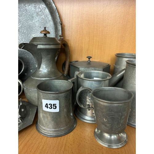 435 - SHELF OF PEWTERWARES INCLUDING BEADED CHARGER, BEATEN TEASERVICE AND SOME TANKARDS