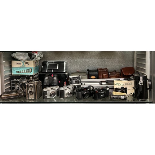 434 - SHELF OF CAMERAS AND ACCESSORIES INCLUDING KODAK, VIVITAR, AND A CORONET BOX CAMERA