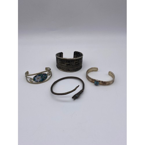 689 - WHITE METAL CABOCHON SET BANGLE, FILIGREE CUFF AND A SERPENT COIL BANGLE