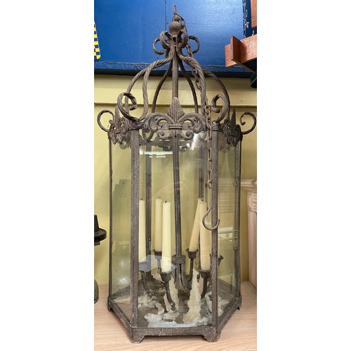 489 - WROUGHT METALWORK FRAMED HEXAGONAL GLAZED HANGING LANTERN