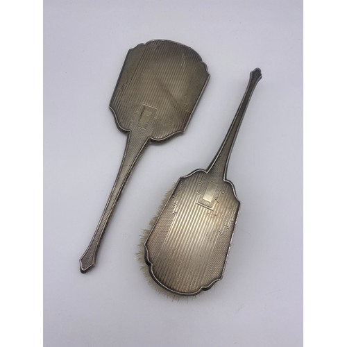 509 - BIRMINGHAM SILVER BACKED ART DECO HAND MIRROR AND BRUSH