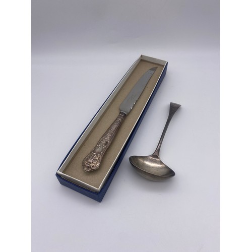 502 - BOXED STERLING SILVER HANDLED CAKE KNIFE AND A SHEFFIELD SILVER LADLE