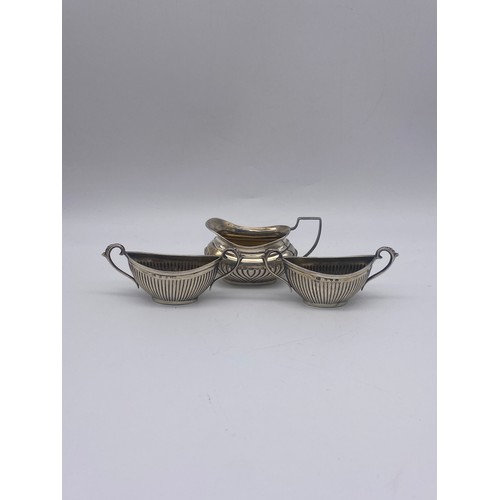 505 - BIRMINGHAM SILVER MINATURE JUG AND PAIR OF BOAT SHAPED TWIN HANDLED TABLE SALTS 2OZ OVERALL APPROX