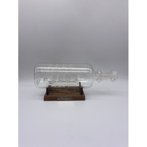 495 - GLASS BLOWN SPANISH GALLEON IN BOTTLE ON STAND