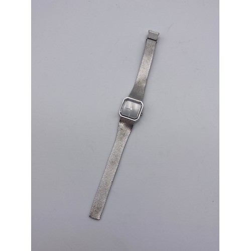 676 - LADIES TITUS 17 JEWELLS STAINLESS STEEL OCTAGONAL FACED WRISTWATCH ON TEXTURED STRAP