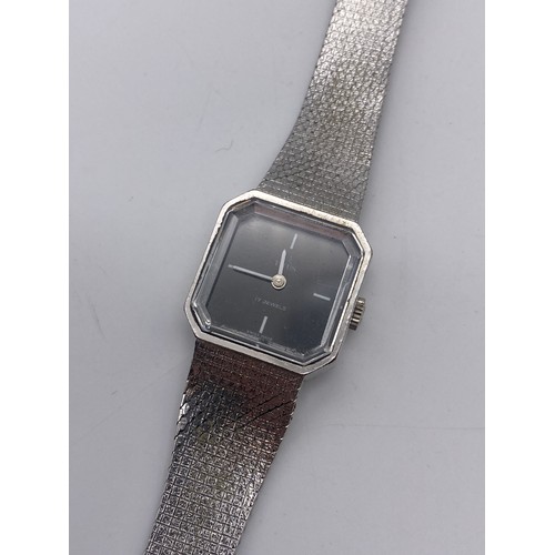 676 - LADIES TITUS 17 JEWELLS STAINLESS STEEL OCTAGONAL FACED WRISTWATCH ON TEXTURED STRAP