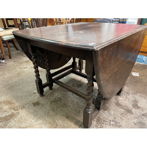 56 - OAK OVAL DROP FLAP BARLEY TWIST GATELEG TABLE