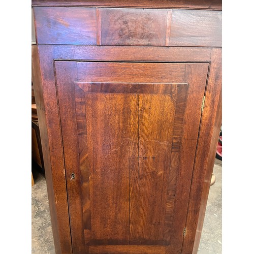 76 - EARLY 19TH CENTURY OAK AND MAHOGANY CROSS BANDED HANGING CORNER CUPBOARD WITH DRAWER BASE