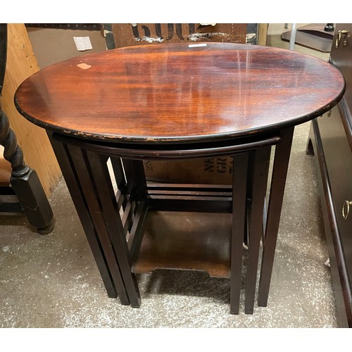 109 - NEST OF OVAL GADROONED MAHOGANY TABLES