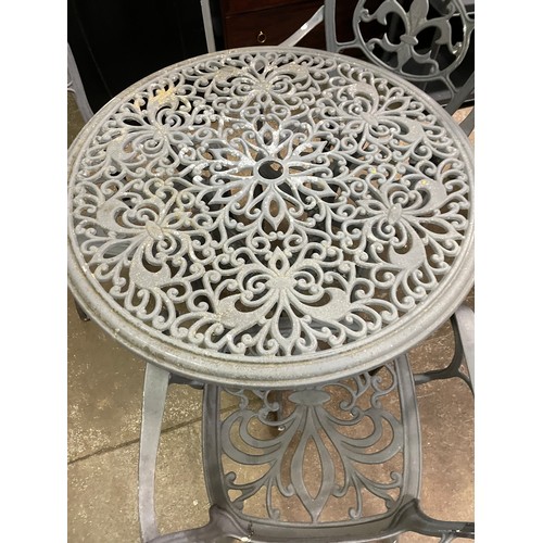 178 - VICTORIAN STYLE CIRCULAR CAST METAL PATIO TABLE AND THREE CHAIRS