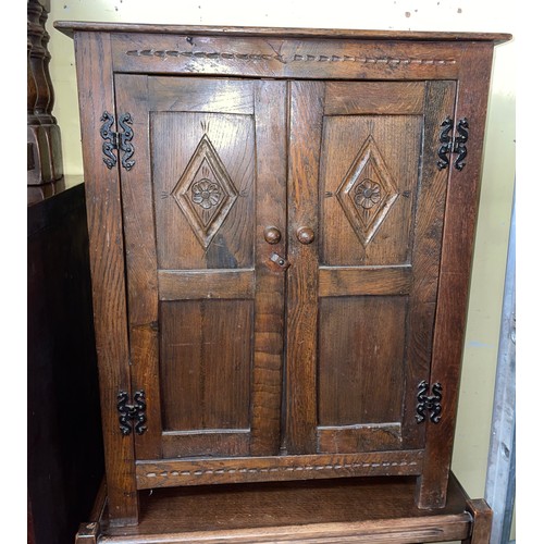 260 - REPRODUCTION OAK CARVED TWO DOOR CUPBOARD