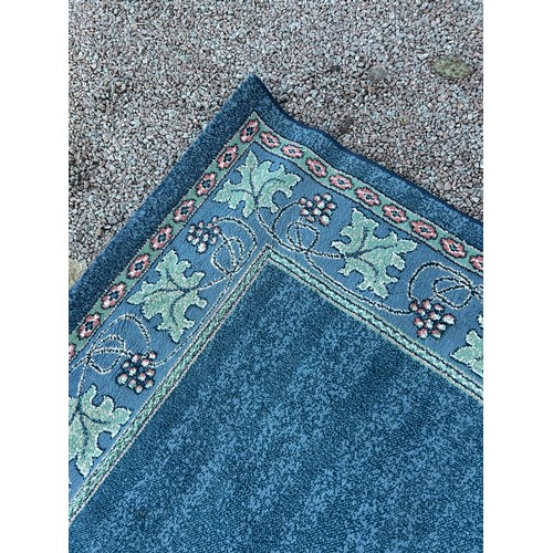 27 - GREEN FLORAL PATTERN CARPET