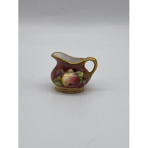 521 - ROYAL WORCESTER MONK CANDLE SNUFFER, PIN HEAD DOLL, GOEBEL FIGURES AND COALPORT FRUIT PAINTED MINIAT... 