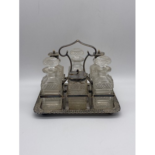 519 - SIX AND FOUR PIECE PLATED CRUET SETS, AND A SARDINE DISH AND COVER