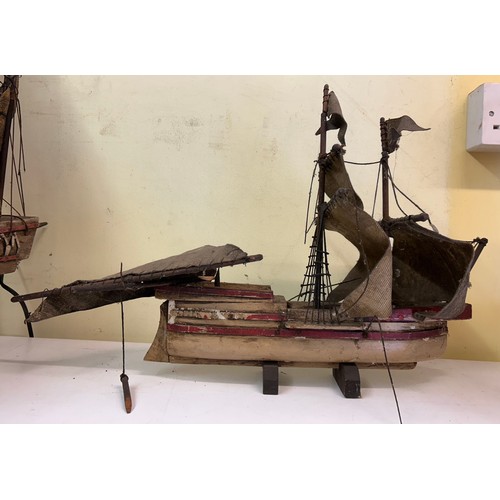 501 - TWO WOODEN CARVED GALLEON MODELS ON STANDS