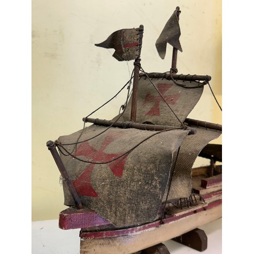 501 - TWO WOODEN CARVED GALLEON MODELS ON STANDS