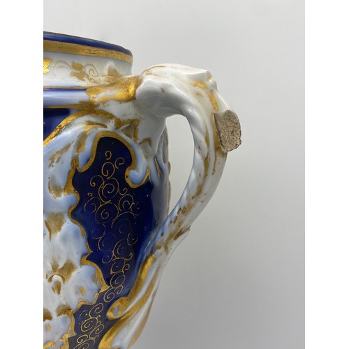 538 - CONTINENTAL BLEU DE ROI AND GILT TWIN HANDLED VASE A/F