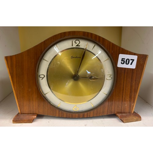 507 - WALNUT MANTLE CLOCK AND OAK CASED EIGHT DAY CLOCK AND ONE OTHER