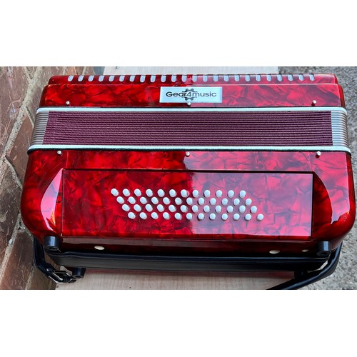 396 - GEAR FOR MUSIC RED MARBLED ACCORDIAN IN CARRY CASE WITH MUSIC BOOKS