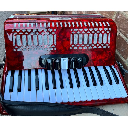 396 - GEAR FOR MUSIC RED MARBLED ACCORDIAN IN CARRY CASE WITH MUSIC BOOKS