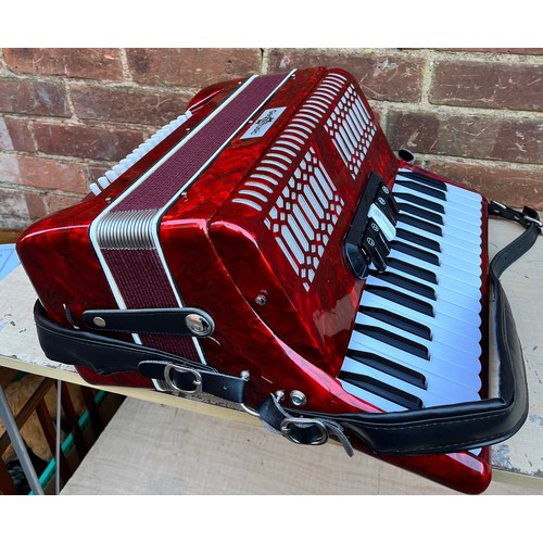 396 - GEAR FOR MUSIC RED MARBLED ACCORDIAN IN CARRY CASE WITH MUSIC BOOKS