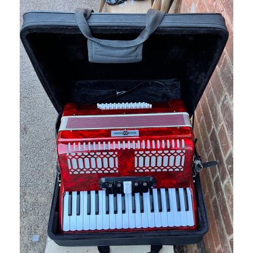 396 - GEAR FOR MUSIC RED MARBLED ACCORDIAN IN CARRY CASE WITH MUSIC BOOKS