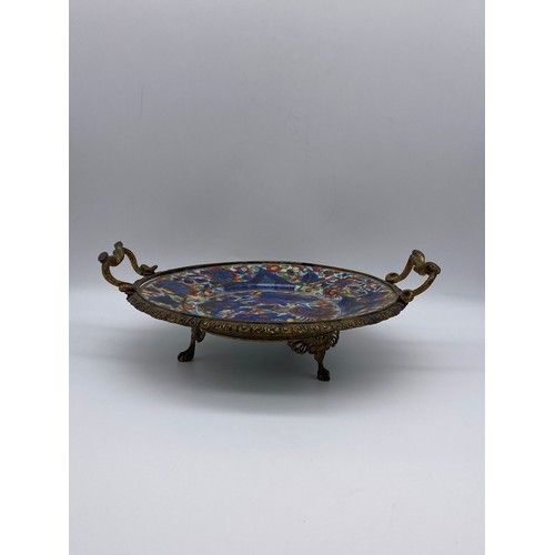 633 - CHINESE POTTERY PLATE CONVERTED TO SERVING TRAY WITH GILT METAL TWIN HANDLED SERPENT DESIGN A/F