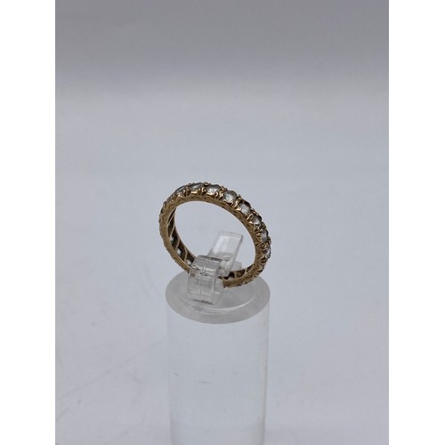 681 - 9CT GOLD STONE SET ETERNITY BAND SIZE M 2.4G APPROX