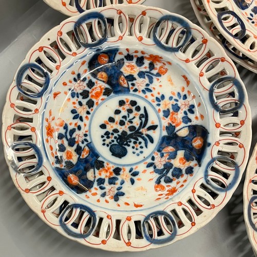 618 - SEVEN IMARI PATTERN PLATES WITH PIERCED BORDERS