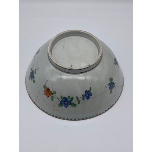 554 - CHINESE INSPIRED BOWL DECORATED WITH A MYTHICAL CREATURE AND FLORAL MOTIF A/F