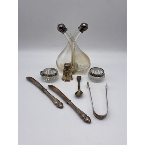 624 - TWO GLASS SILVER RIMMED SALTS, PAIR OF SCOTTISH SILVER SUGAR TONGS AND VINAIGRETTE AND FLATWARE