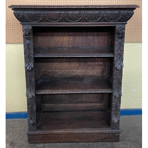 157 - VICTORIAN CARVED OAK OPEN BOOKCASE WITH LIONS HEAD CAPITALS