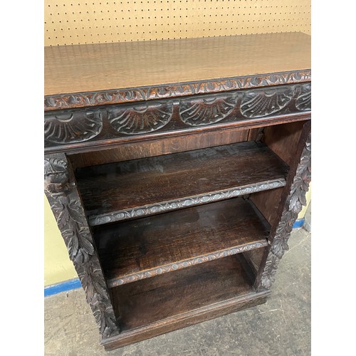 157 - VICTORIAN CARVED OAK OPEN BOOKCASE WITH LIONS HEAD CAPITALS