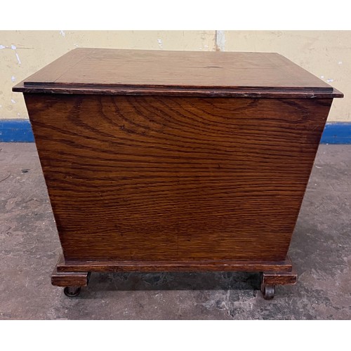 148 - OAK TRAPEZIUM SHAPED COAL BOX ON WHEELS